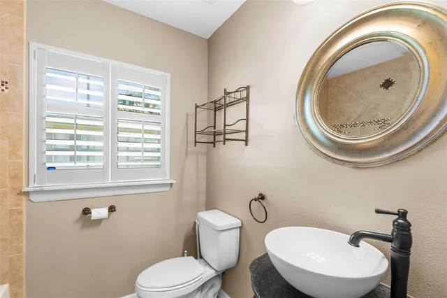 a bathroom with a toilet a sink and a bathtub