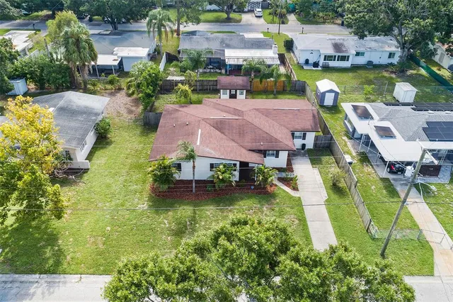 an aerial view of residential houses with city view