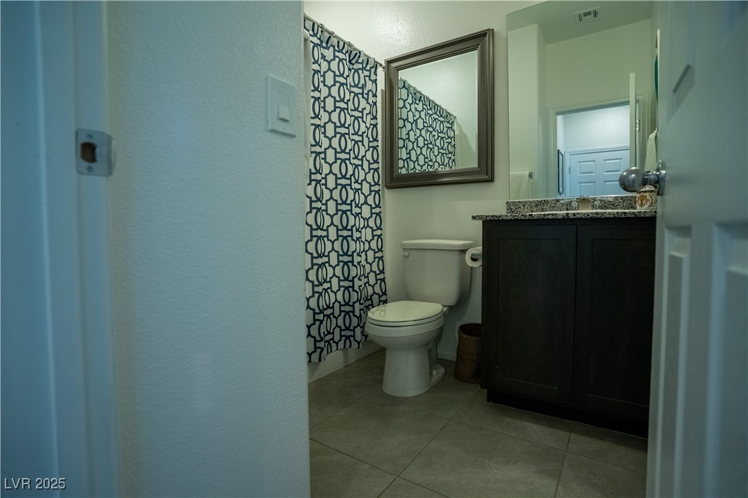 662 Foam Flower Lane Henderson, NV 89015 - Photo 11 of 14 Full bathroom with vanity, tile patterned floors,