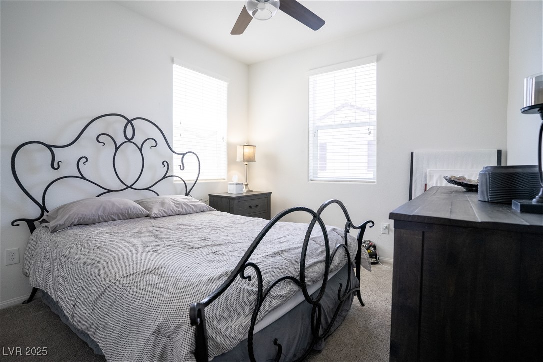 662 Foam Flower Lane Henderson, NV 89015 - Photo 12 of 14 Carpeted bedroom featuring baseboards and a ceilin