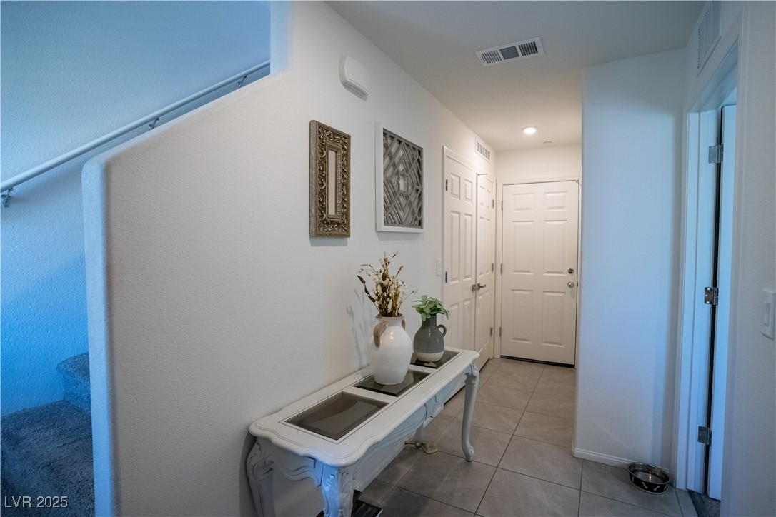 662 Foam Flower Lane Henderson, NV 89015 - Photo 5 of 14 Hall with light tile patterned flooring and recess