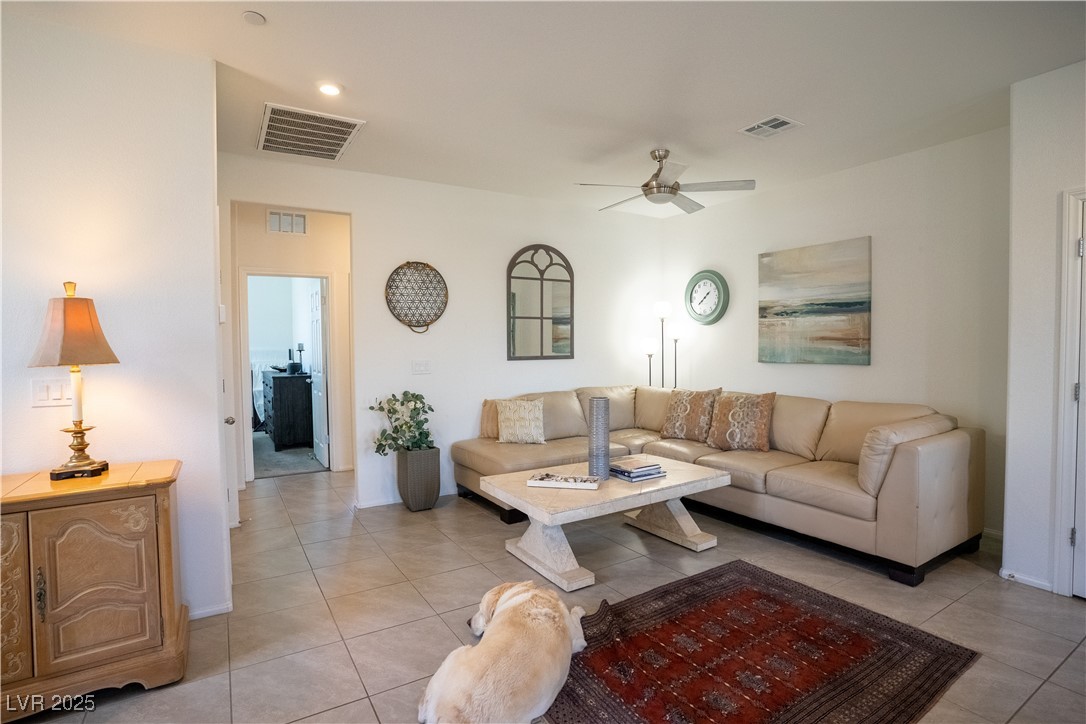 662 Foam Flower Lane Henderson, NV 89015 - Photo 8 of 14 Living room with light tile patterned floors and a