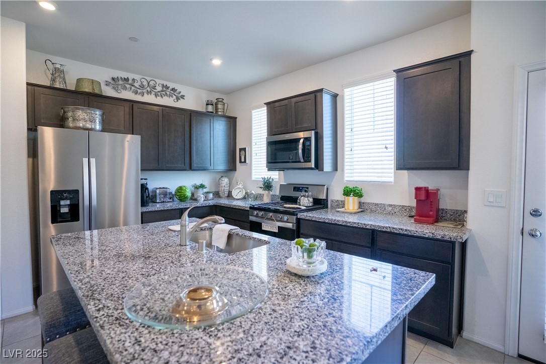 662 Foam Flower Lane Henderson, NV 89015 - Photo 10 of 14 Kitchen with stainless steel appliances, dark brow