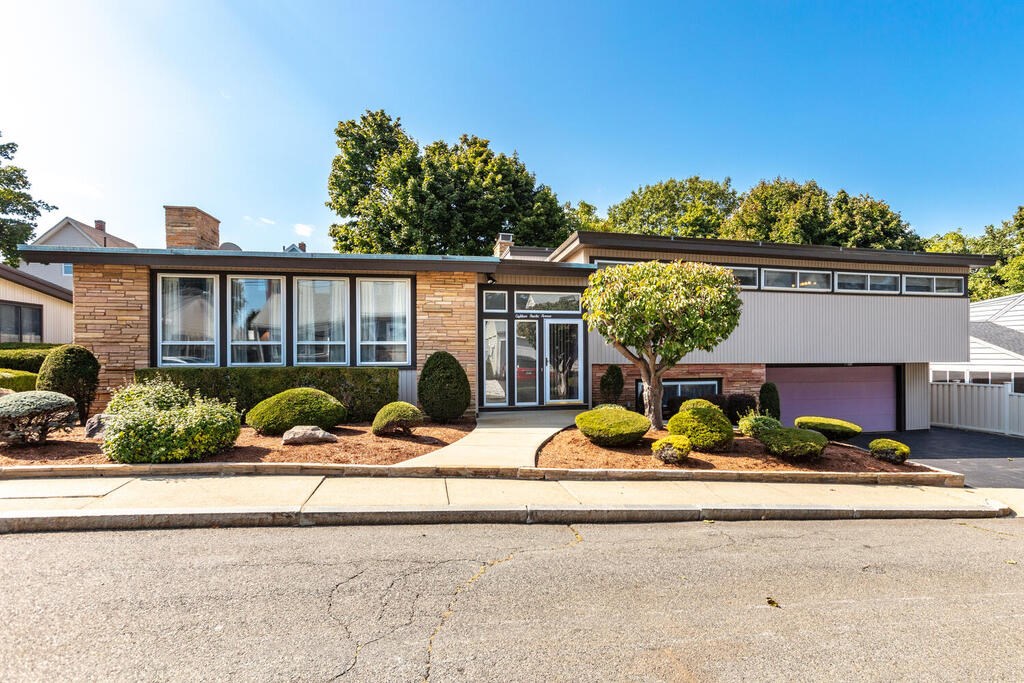 18 Amelia Avenue Winthrop, MA 02152 - Photo 1 of 34 front view of a house with a small yard