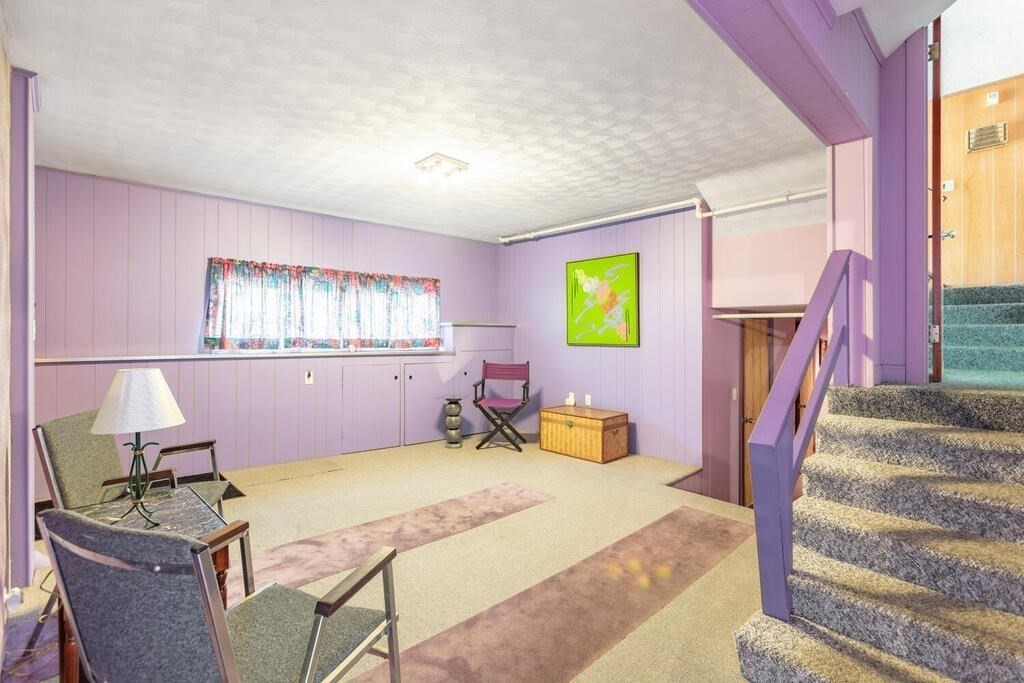 18 Amelia Avenue Winthrop, MA 02152 - Photo 22 of 34 a bed room with a bed furniture and a fireplace