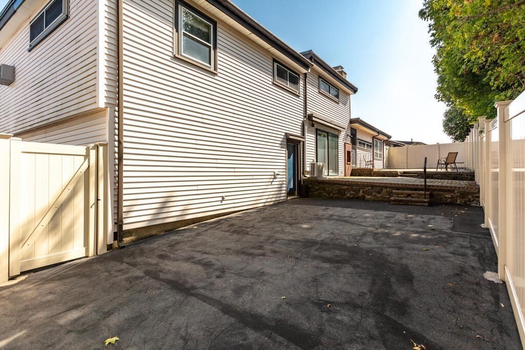 18 Amelia Avenue Winthrop, MA 02152 - Photo 26 of 34 a view of a house with a yard