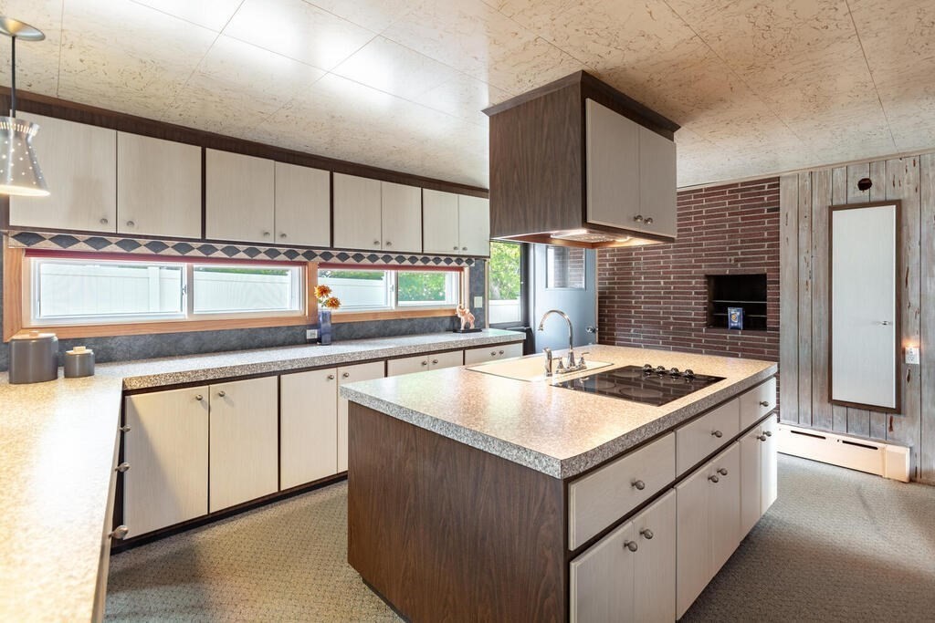 18 Amelia Avenue Winthrop, MA 02152 - Photo 10 of 34 a kitchen with stainless steel appliances granite countertop a sink and a stove