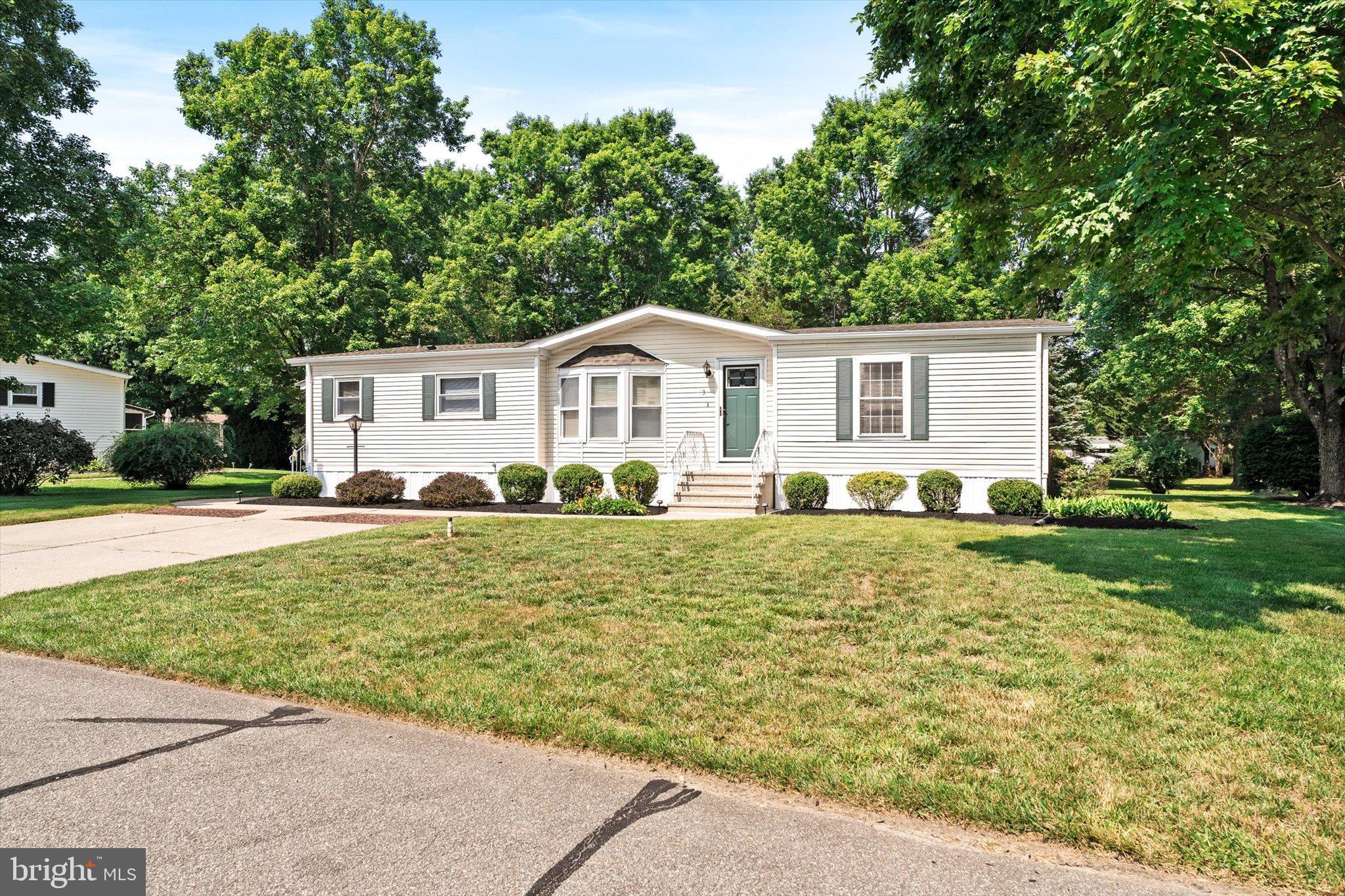 3 Copperfield Drive Cream Ridge, NJ 08514 - Photo 1 of 27 a front view of a house with a garden
