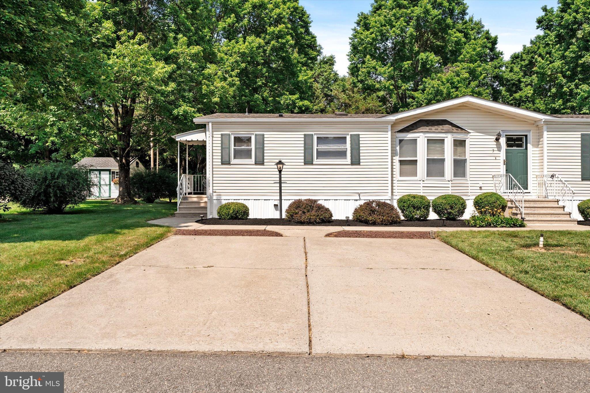 3 Copperfield Drive Cream Ridge, NJ 08514 - Photo 2 of 27 a view of a white house with a yard