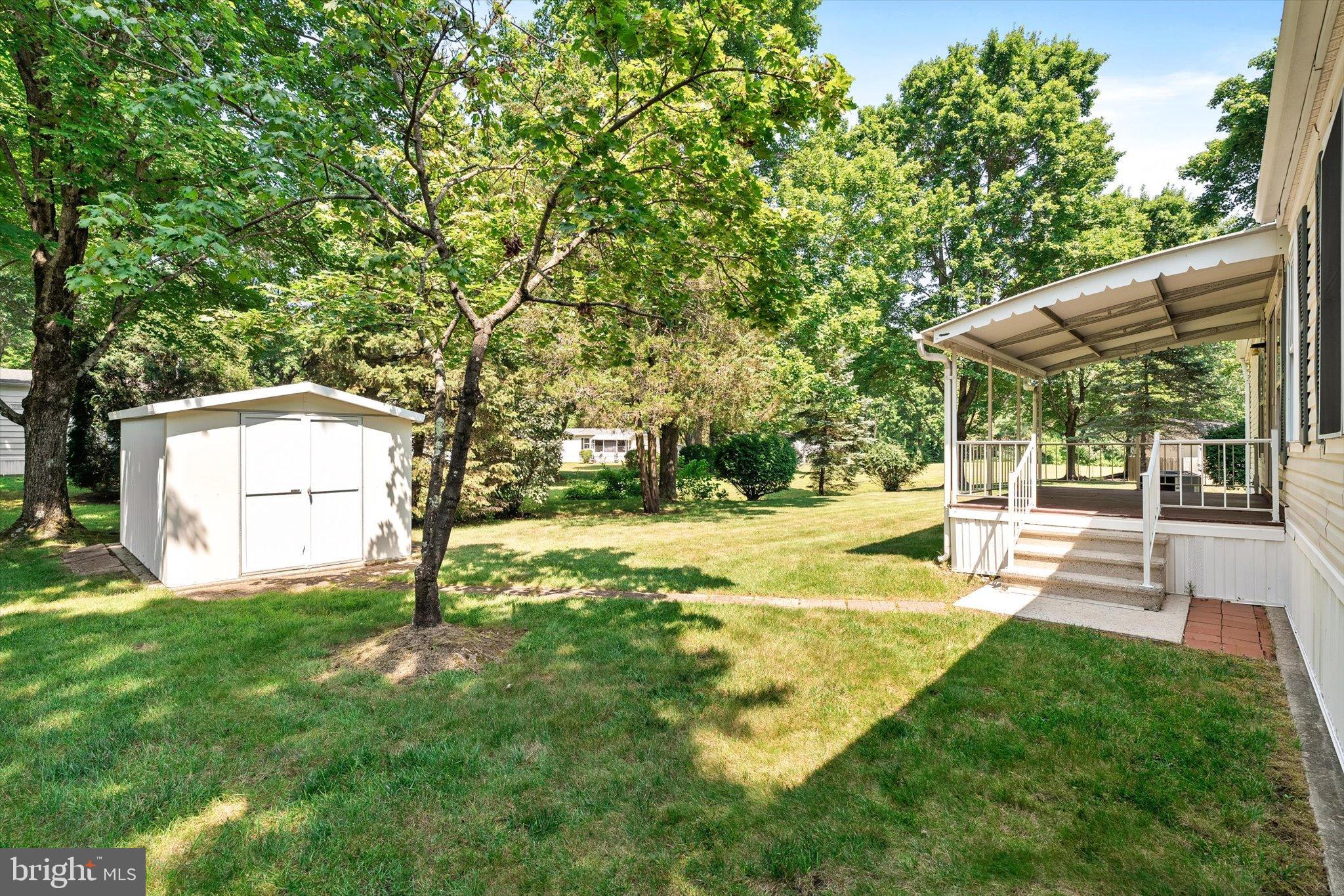 3 Copperfield Drive Cream Ridge, NJ 08514 - Photo 25 of 27 a view of a backyard with a garden and tree