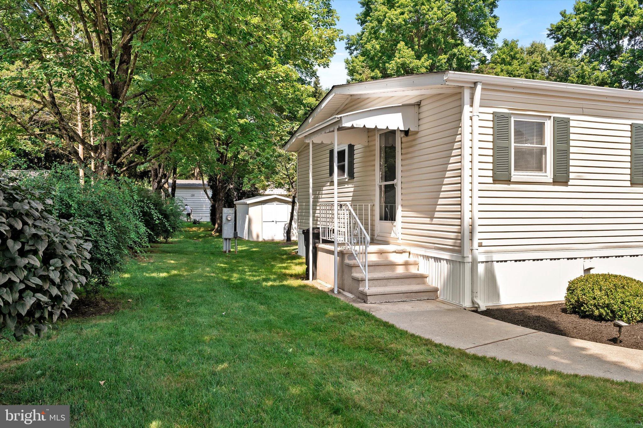 3 Copperfield Drive Cream Ridge, NJ 08514 - Photo 3 of 27 a front view of a house with a yard