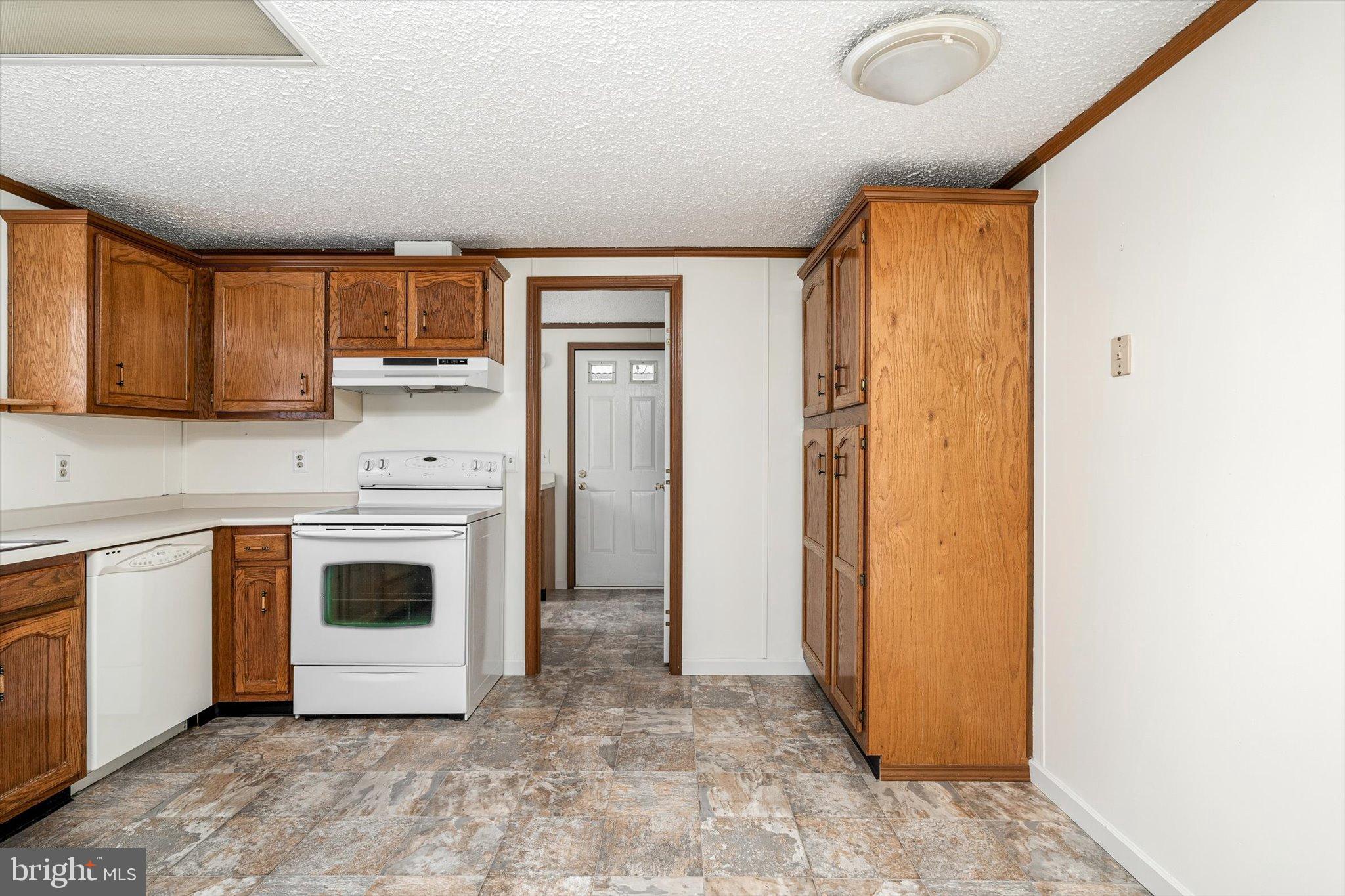 3 Copperfield Drive Cream Ridge, NJ 08514 - Photo 9 of 27 a kitchen with a stove a sink and a refrigerator