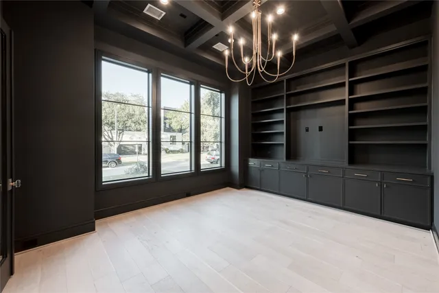 wooden floor in an empty room with a fireplace