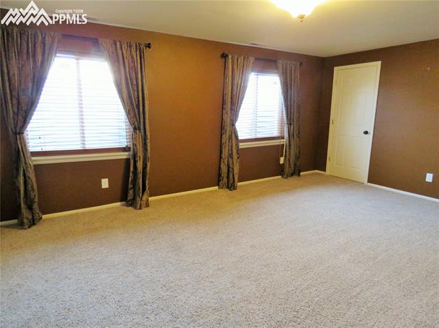 12249 Rio Secco Road Peyton, CO 80831 - Photo 20 of 28 Large Basement Bedroom w/attached Bathroom & 2 Closets!