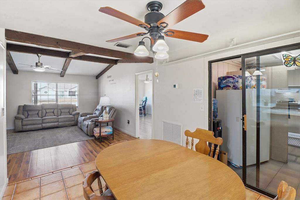 6940 Southeast 52nd Street Ocala, FL 34472 - Photo 11 of 45 a bedroom with furniture and a bed