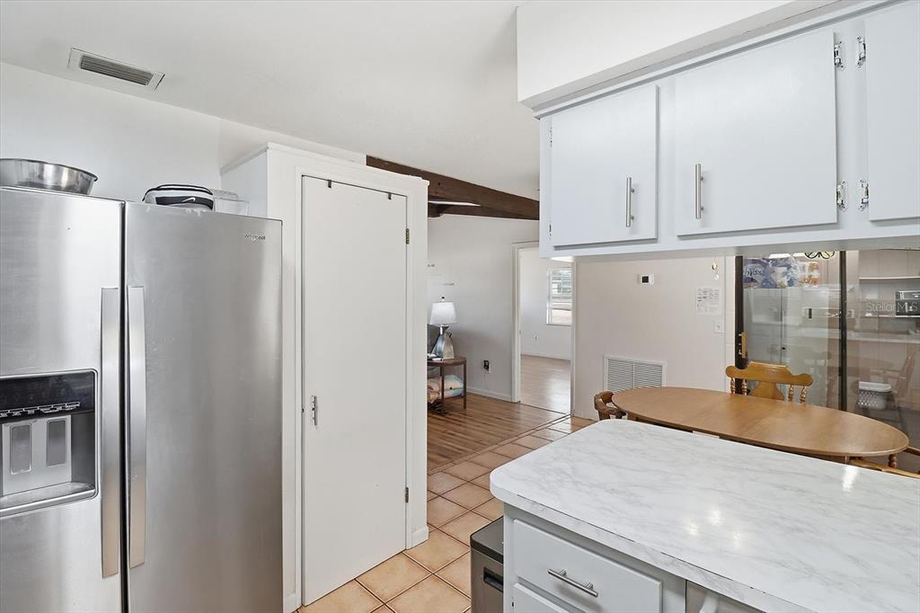 6940 Southeast 52nd Street Ocala, FL 34472 - Photo 15 of 45 a kitchen with stainless steel appliances a refrigerator and cabinets