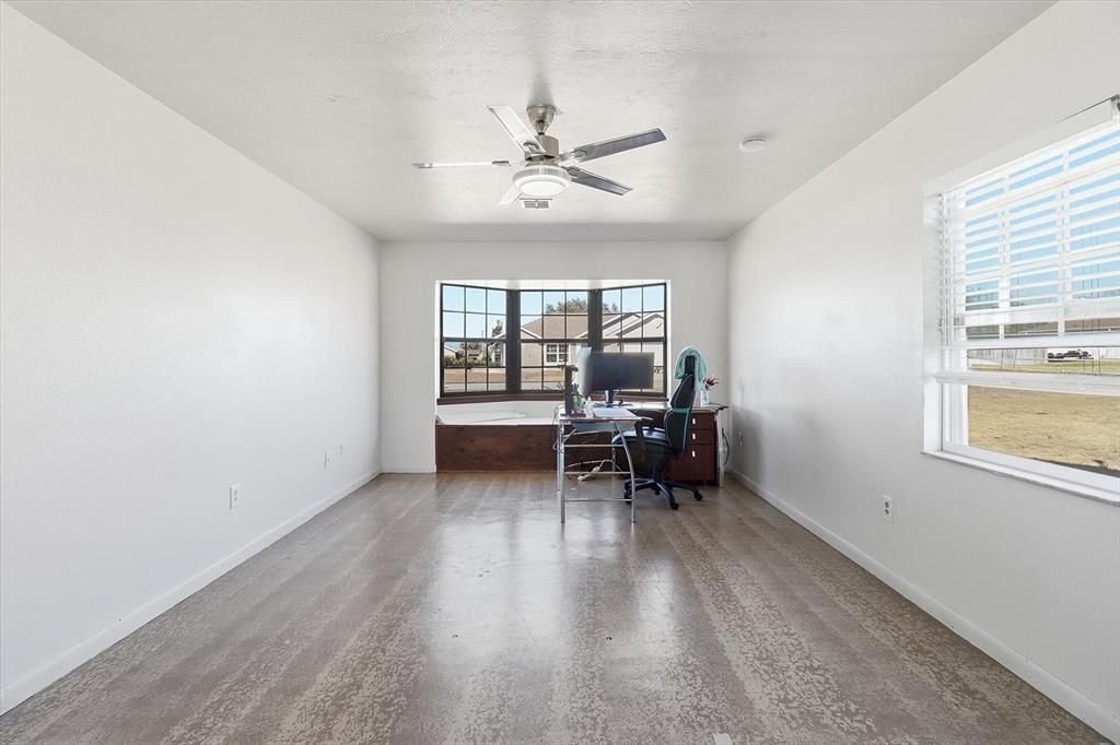 6940 Southeast 52nd Street Ocala, FL 34472 - Photo 16 of 45 wooden floor in a room with a window