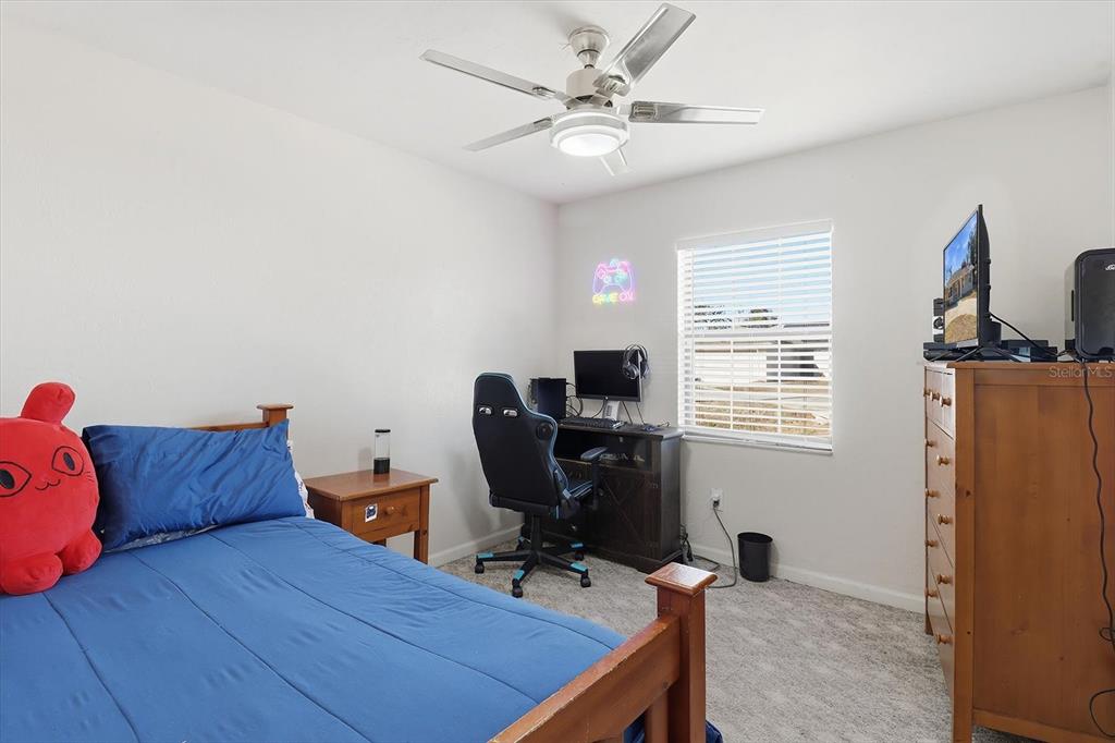 6940 Southeast 52nd Street Ocala, FL 34472 - Photo 23 of 45 a view of a workspace with furniture and a window