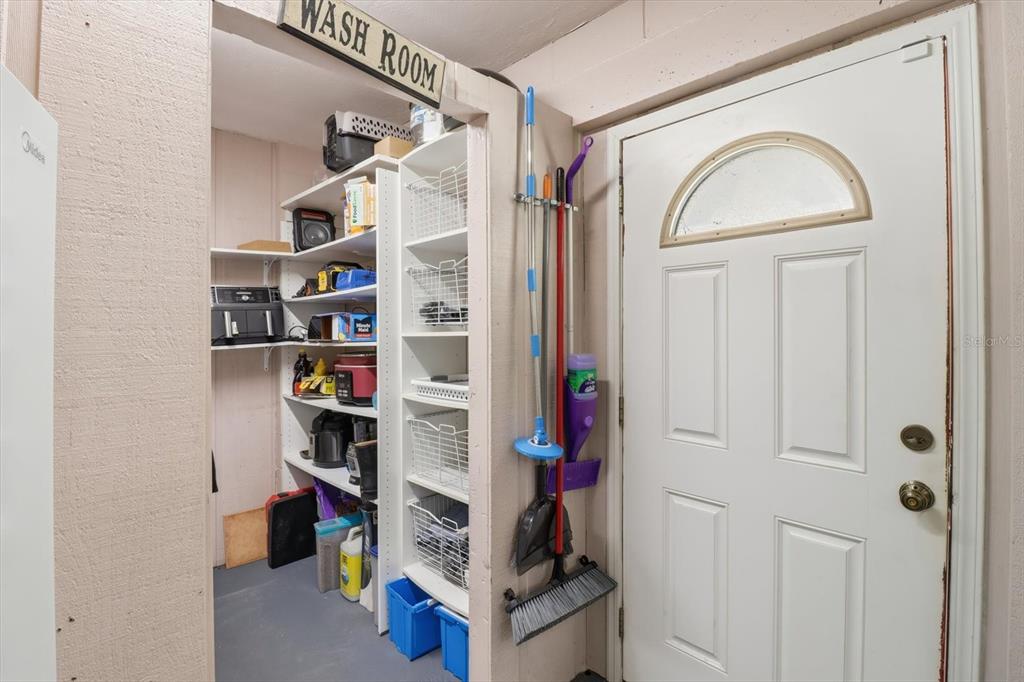 6940 Southeast 52nd Street Ocala, FL 34472 - Photo 30 of 45 a view of walk in closet with clothes and shoes