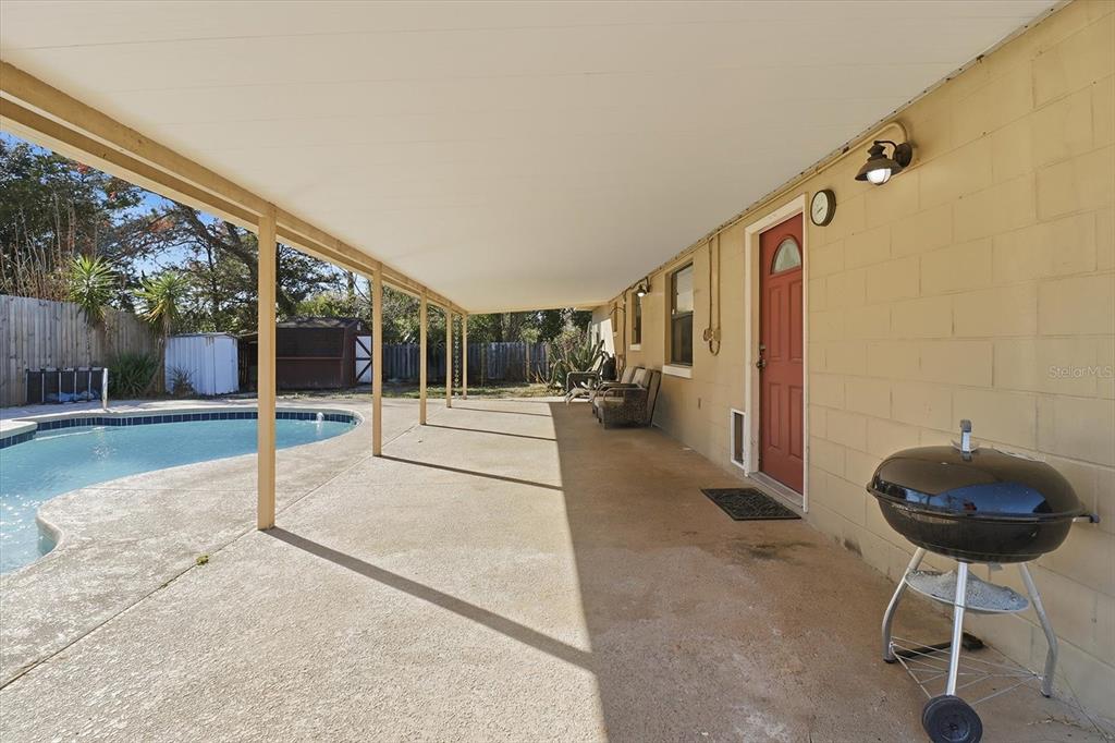 6940 Southeast 52nd Street Ocala, FL 34472 - Photo 34 of 45 a view of a porch with furniture