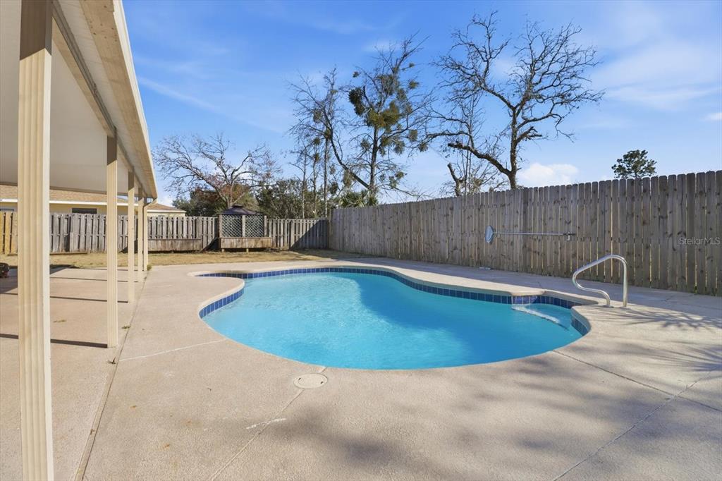 6940 Southeast 52nd Street Ocala, FL 34472 - Photo 36 of 45 a view of outdoor space and swimming pool