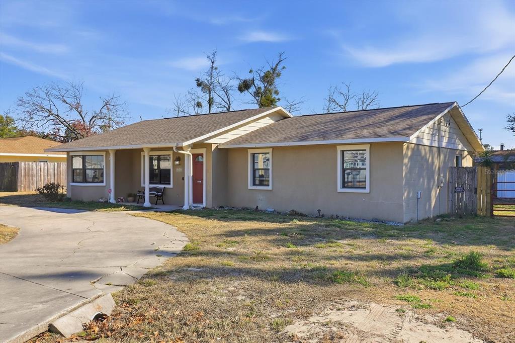6940 Southeast 52nd Street Ocala, FL 34472 - Photo 38 of 45 a view of a house with a yard