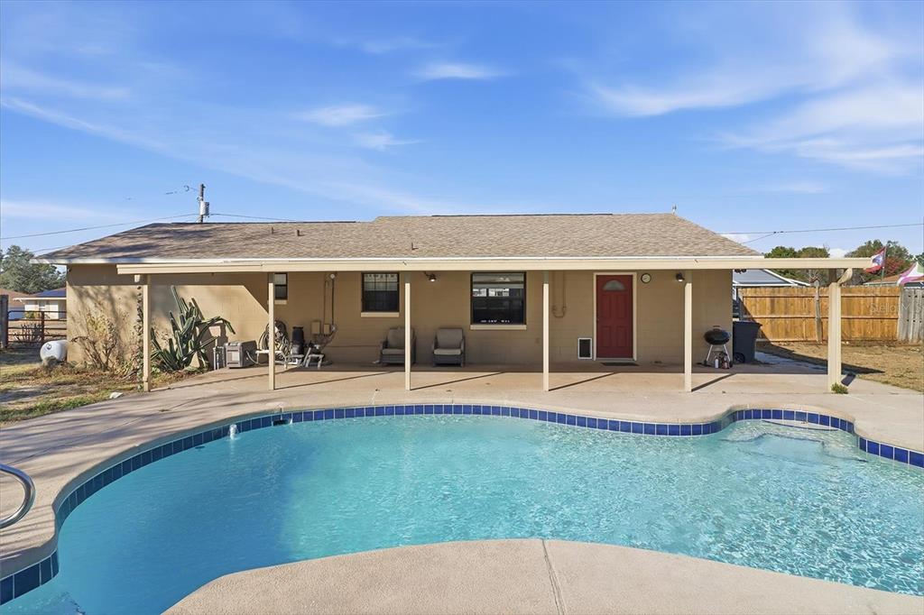 6940 Southeast 52nd Street Ocala, FL 34472 - Photo 4 of 45 front view of a house with a yard