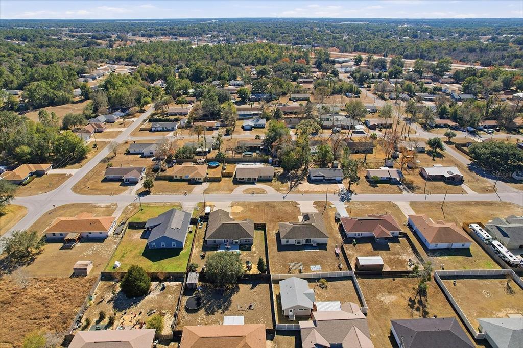 6940 Southeast 52nd Street Ocala, FL 34472 - Photo 43 of 45 an aerial view of residential houses with outdoor space