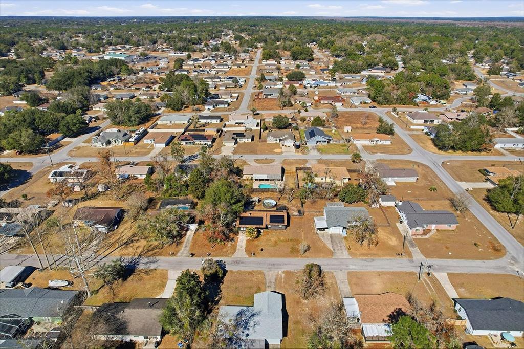6940 Southeast 52nd Street Ocala, FL 34472 - Photo 44 of 45 an aerial view of residential building with parking space