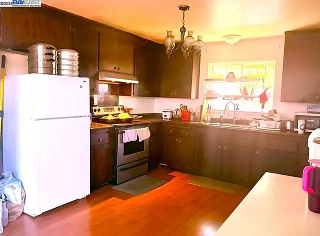 a kitchen with refrigerator and window