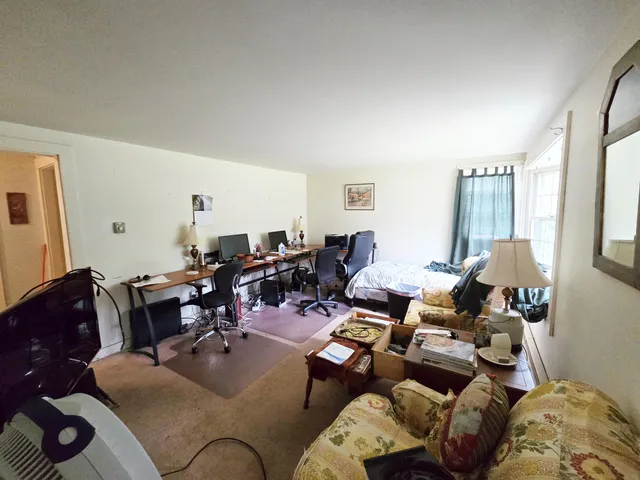 a living room with furniture bunch of windows