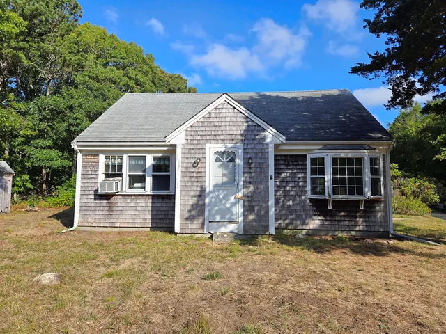 front view of a house with a yard