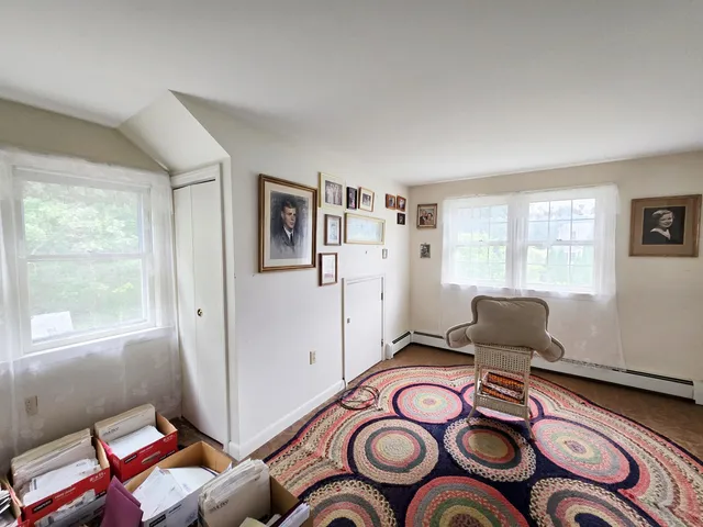 a dining room with furniture and wooden floor
