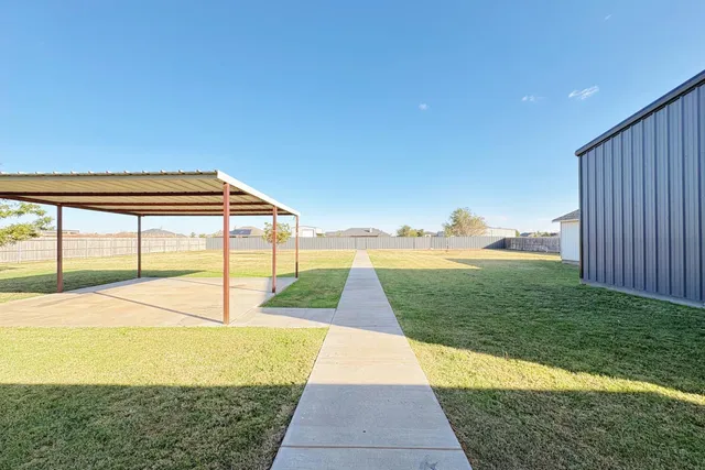 a view of swimming pool from a yard