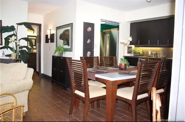 a dining room with furniture and window