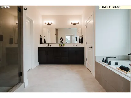 a view of kitchen with stainless steel appliances kitchen island sink and refrigerator