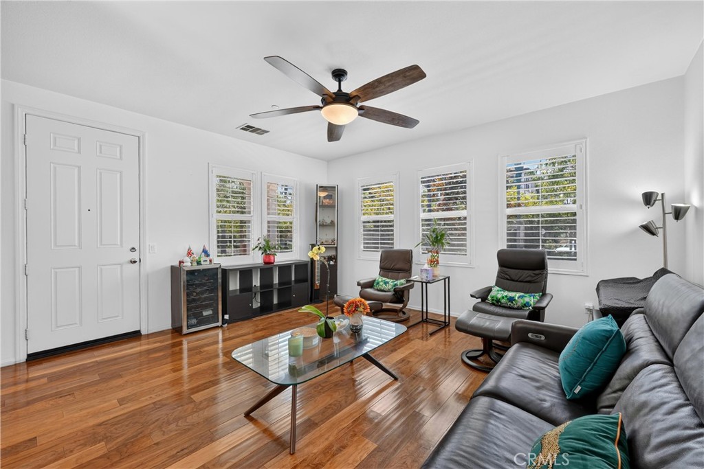 849 The Promenade, Unit D Azusa, CA 91702 - Photo 7 of 37 a living room with furniture or window and a wooden floor