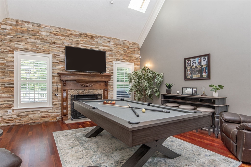 19 Round Farm Road Rehoboth, MA 02769 - Photo 11 of 42 a living room with furniture a flat screen tv and a fireplace