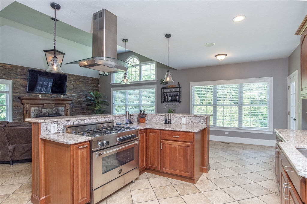 19 Round Farm Road Rehoboth, MA 02769 - Photo 15 of 42 a kitchen with a sink stove and cabinets
