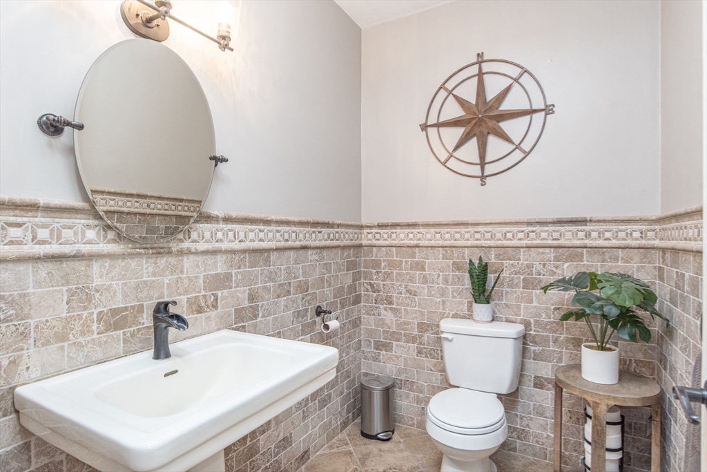 19 Round Farm Road Rehoboth, MA 02769 - Photo 19 of 42 a bathroom with a sink a mirror and a toilet