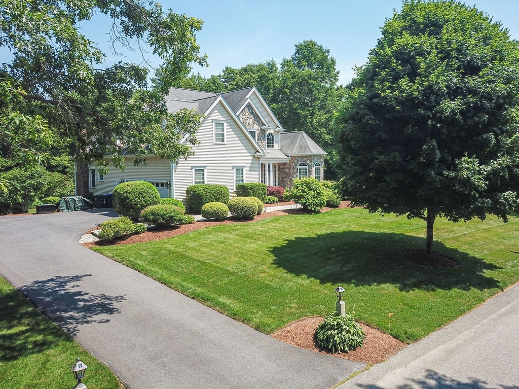 19 Round Farm Road Rehoboth, MA 02769 - Photo 2 of 42 a front view of a house with a yard