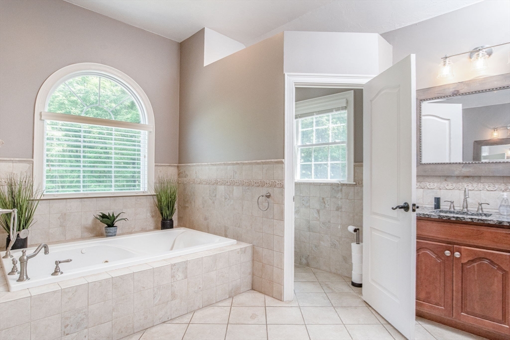 19 Round Farm Road Rehoboth, MA 02769 - Photo 25 of 42 a spacious bathroom with a tub sink and a shower
