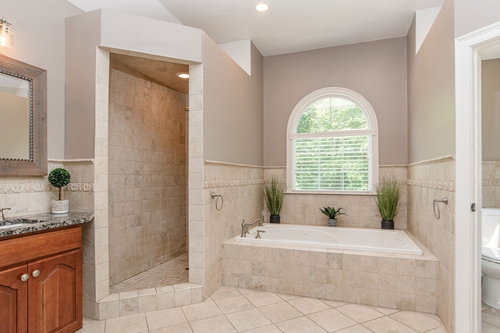 19 Round Farm Road Rehoboth, MA 02769 - Photo 26 of 42 a bathroom with a granite countertop tub shower and a sink
