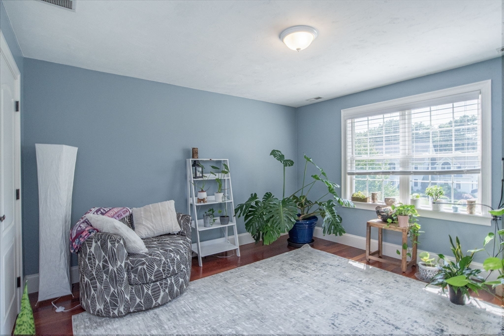 19 Round Farm Road Rehoboth, MA 02769 - Photo 32 of 42 a living room with furniture and a potted plant
