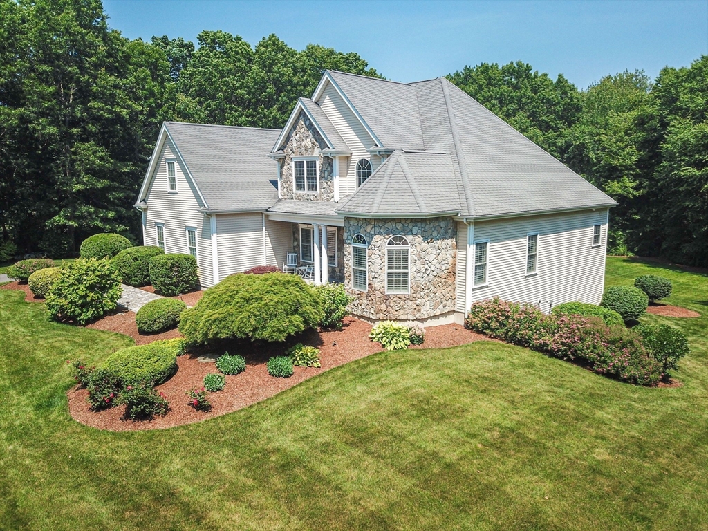 19 Round Farm Road Rehoboth, MA 02769 - Photo 40 of 42 a view of a white house with a big yard and potted plants