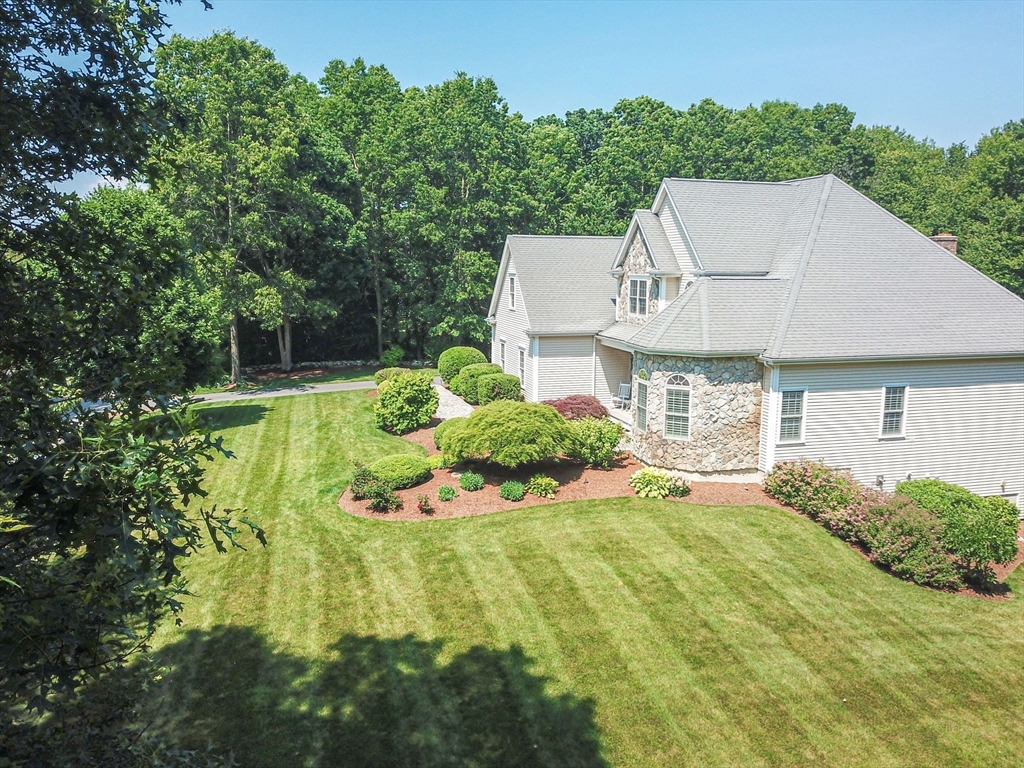 19 Round Farm Road Rehoboth, MA 02769 - Photo 41 of 42 a aerial view of a house with a yard table and chairs