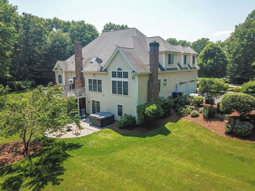 19 Round Farm Road Rehoboth, MA 02769 - Photo 42 of 42 a view of a house with a yard and potted plants