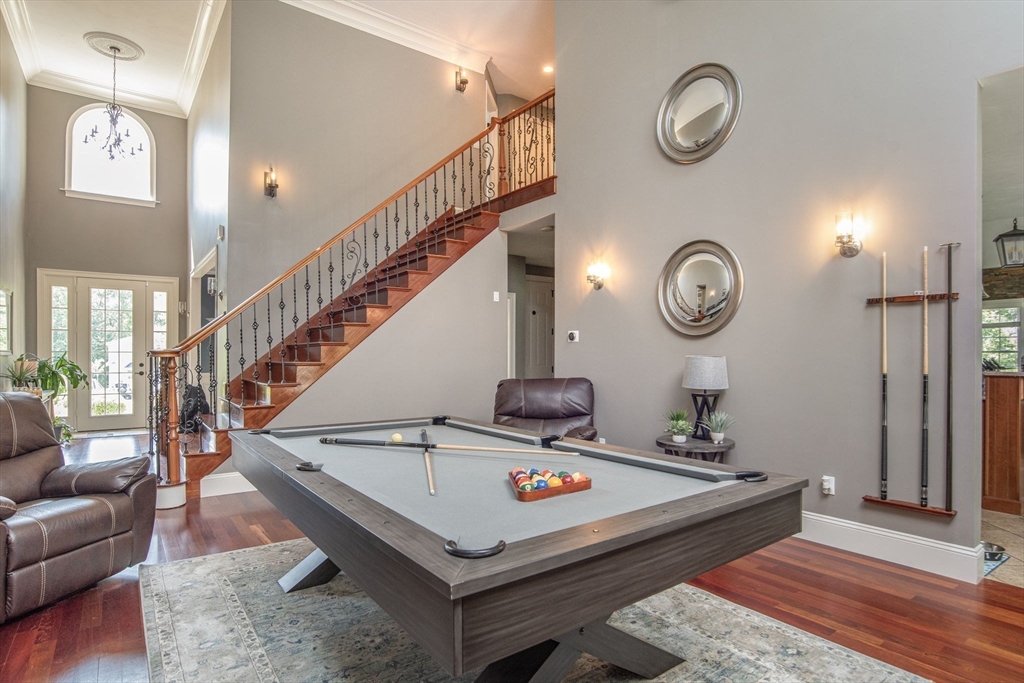 19 Round Farm Road Rehoboth, MA 02769 - Photo 9 of 42 a living room with a table and a potted plant