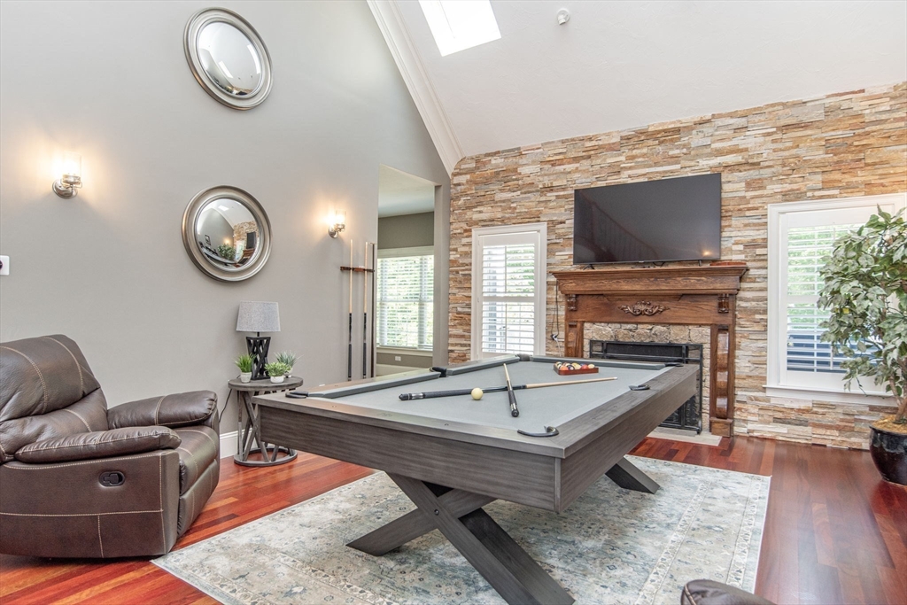 19 Round Farm Road Rehoboth, MA 02769 - Photo 10 of 42 a living room with furniture a fireplace and a flat screen tv
