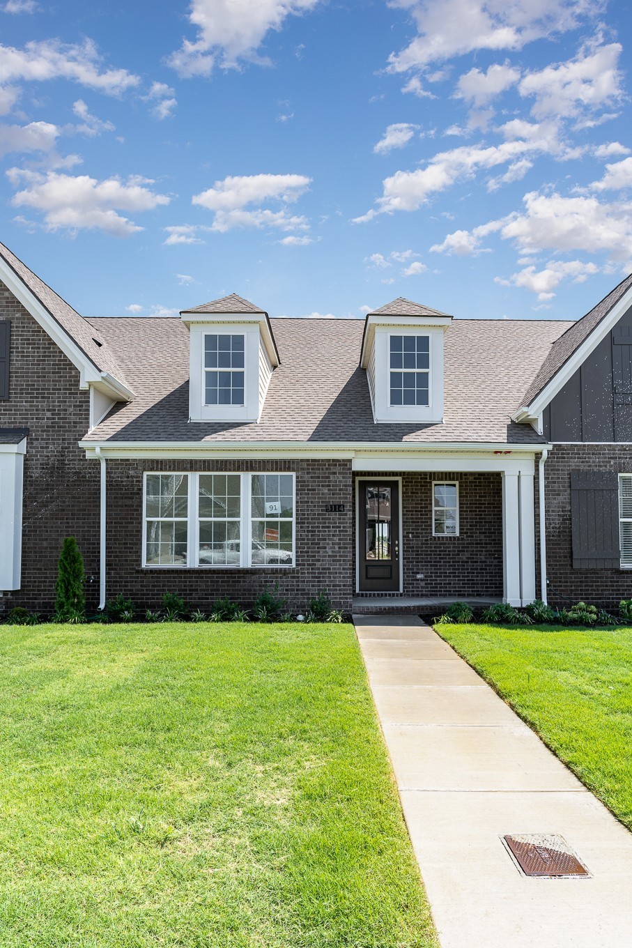 1079 Wrights Mill Road, Unit H8 Spring Hill, TN 37174 - Photo 54 of 64 a view of a yard in front of a brick house with a small yard
